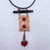Copper, horn, and glass necklace