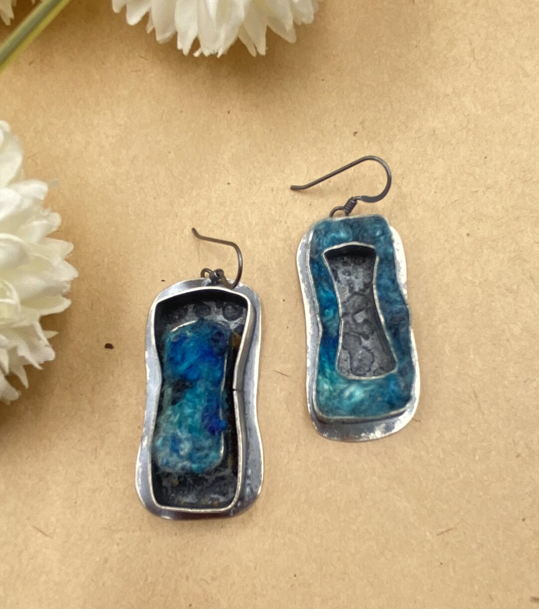 Sterling silver earrings. Asymmetrical. With blue bamboo roving felted into either an outside rectangle or the inner rectangle.